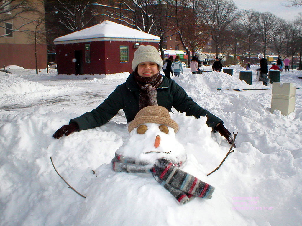 Thaissa squints with snowman