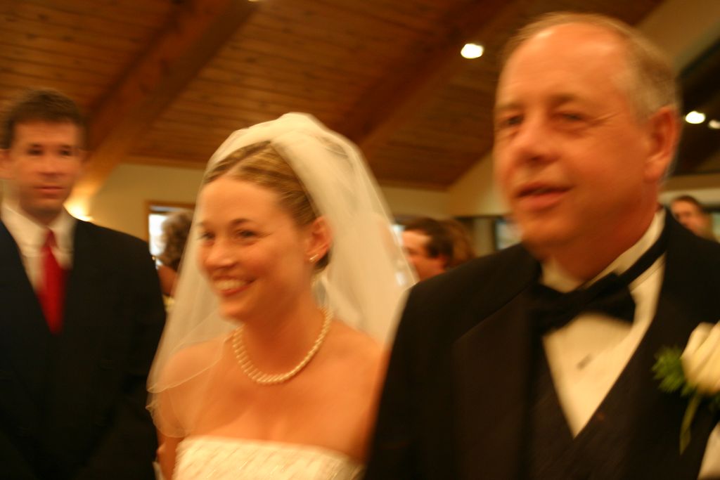 Julia has a big smile as she walk down the isle