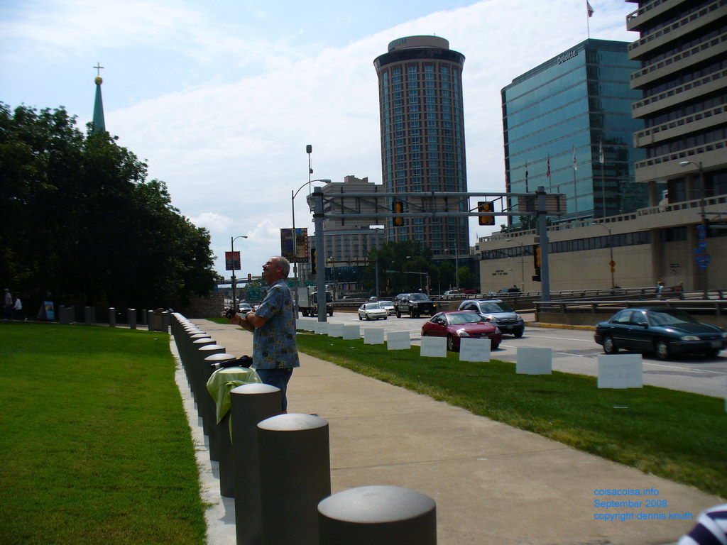 Sherri photographs the street scene at the arch