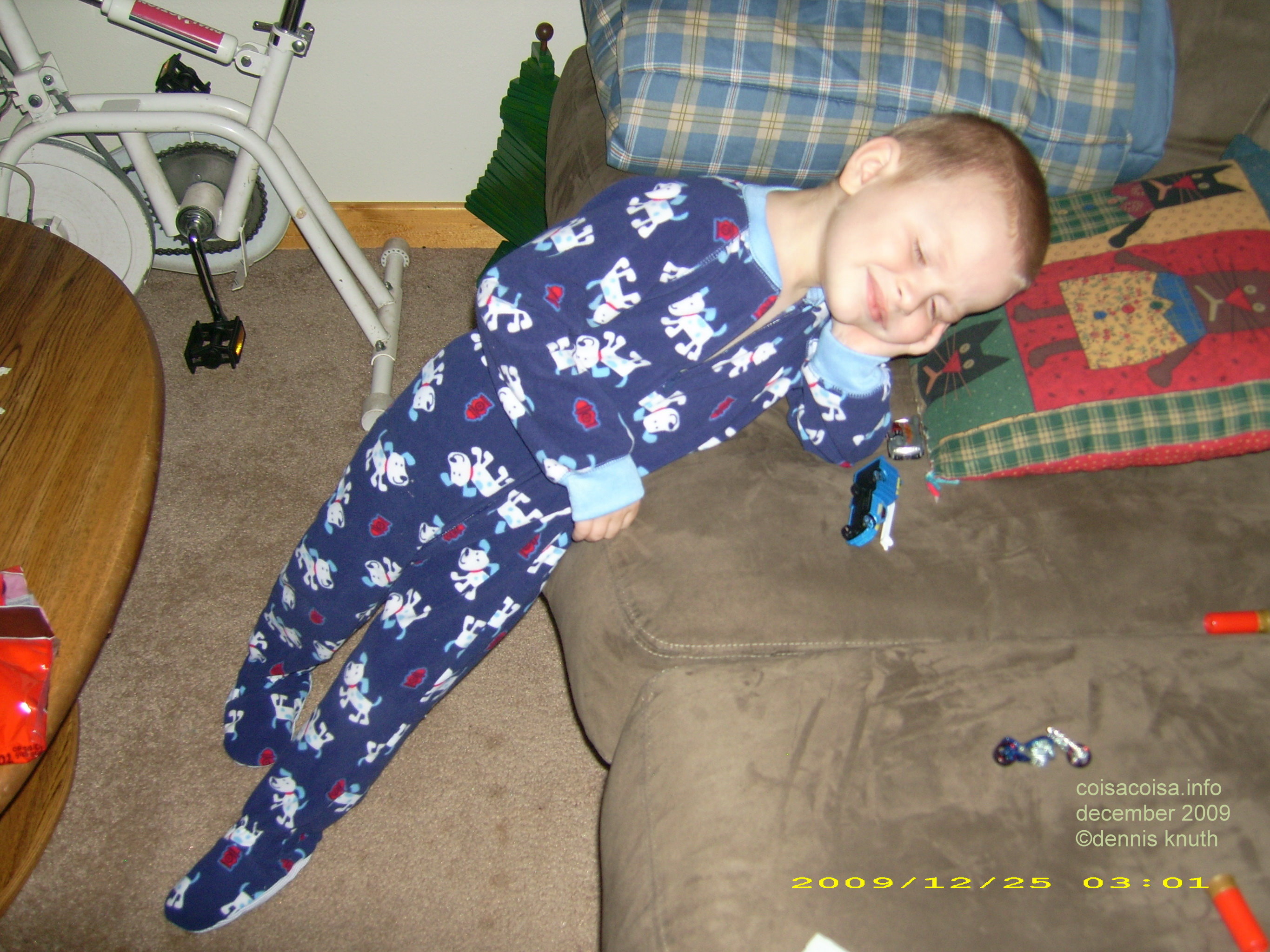 Tired from opening all the gifts, Jared, demurrs on the sofa