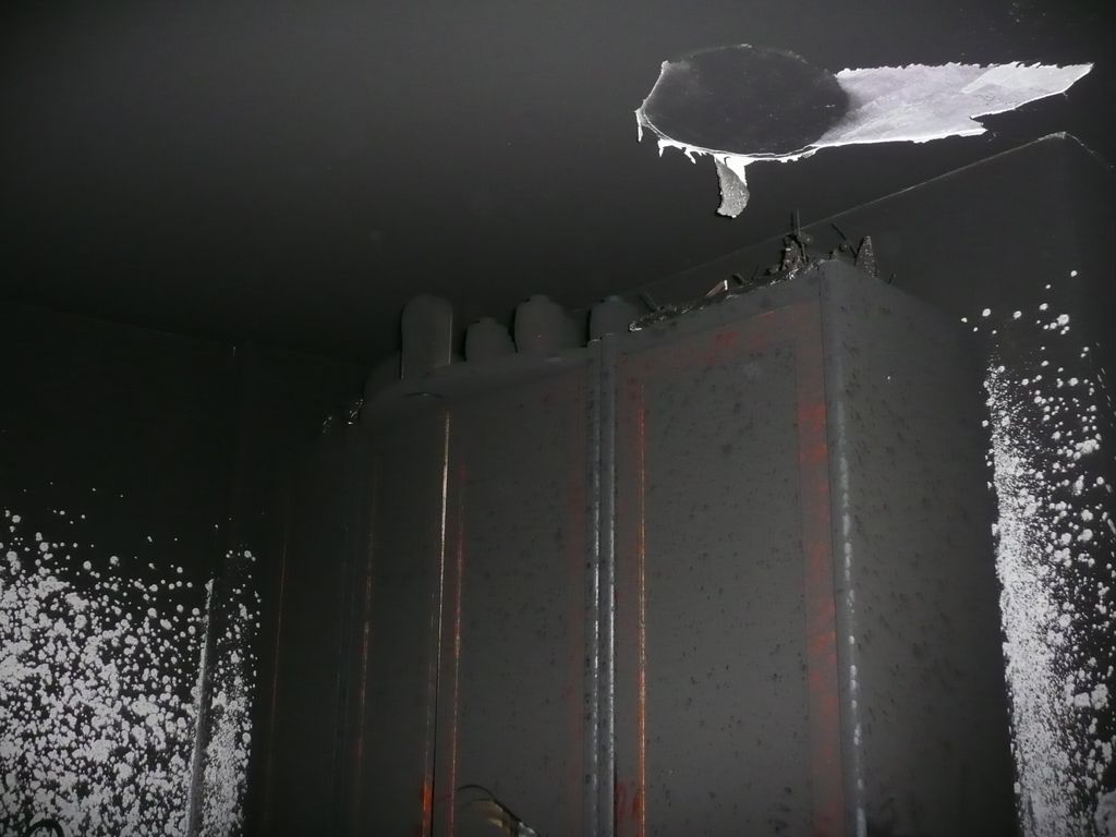 Tar coated bookcase and ceiling