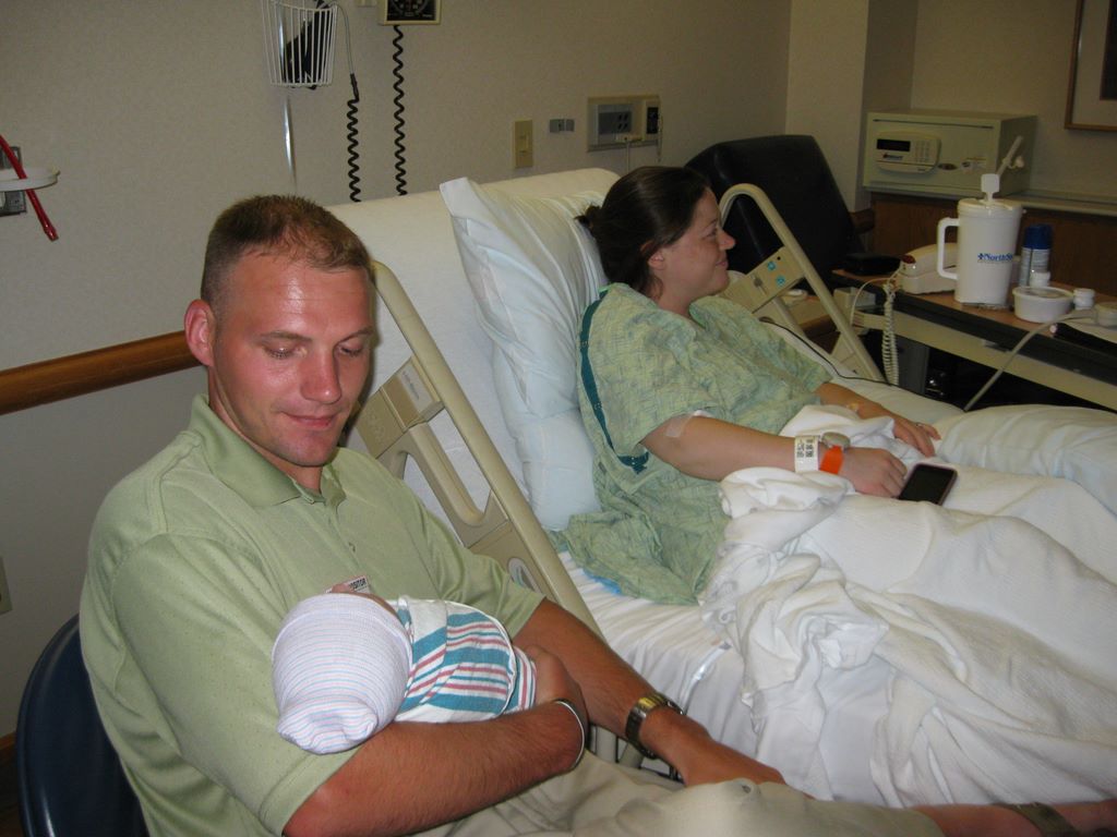 Doting Dad and mom after new born comes