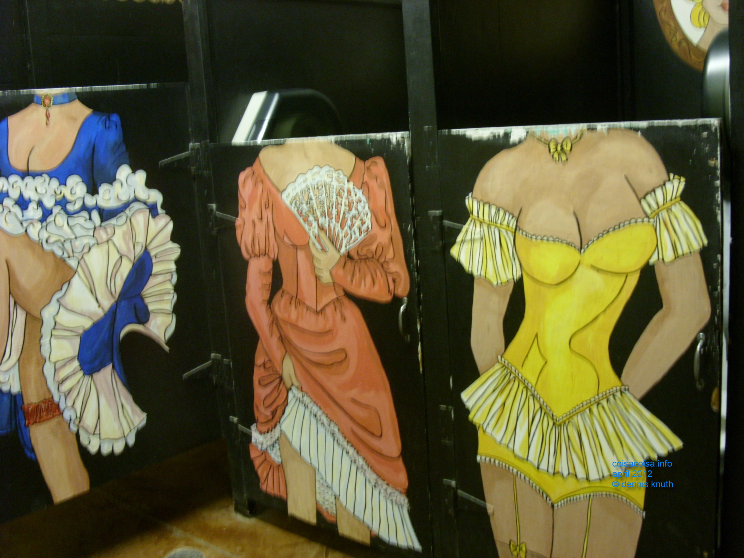 Three women's toilet stall doors