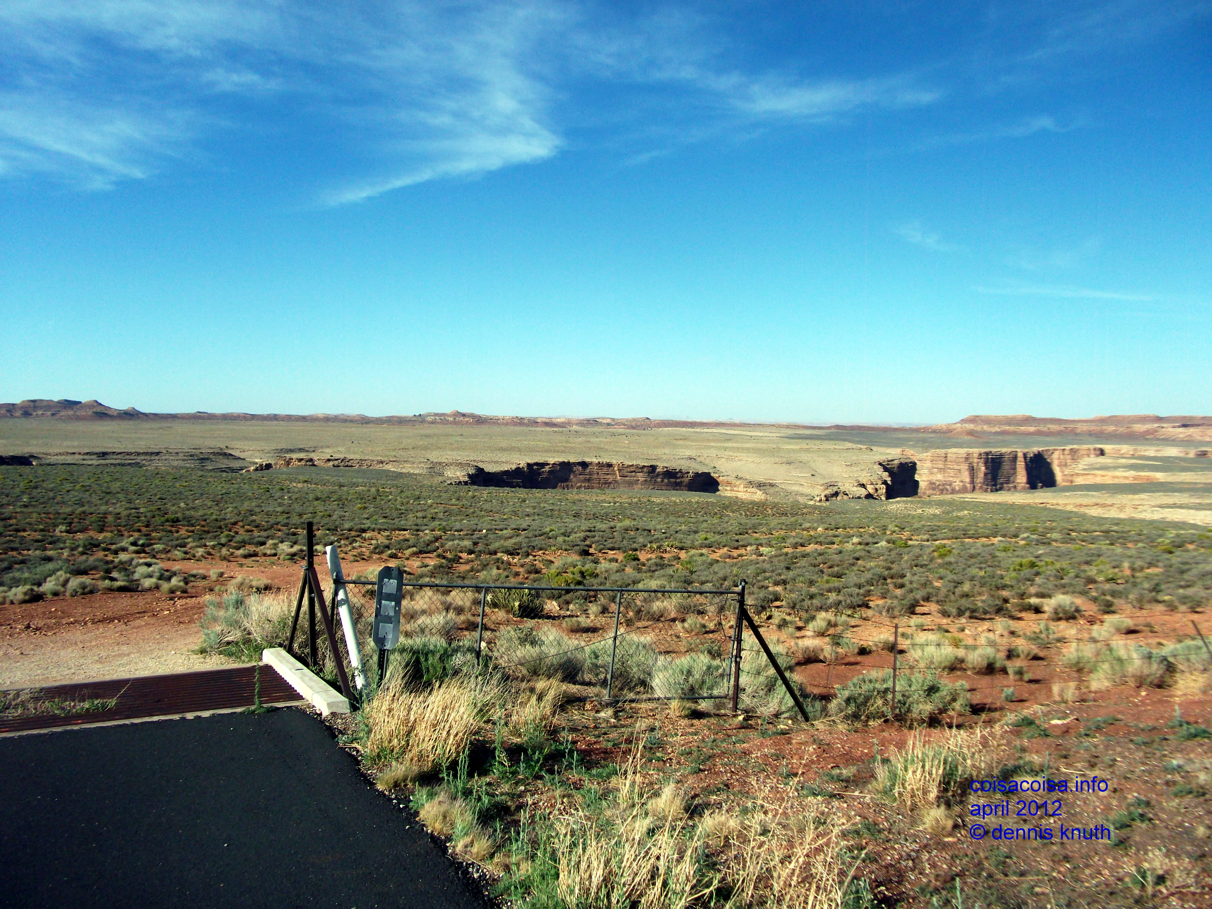 A small canyon winds through some grazing land