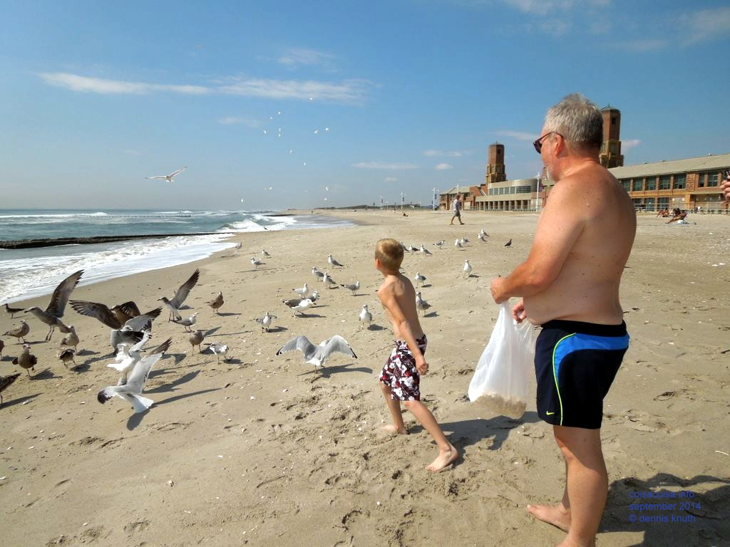 Jared and Dennis feeding popcorn to the seaguls