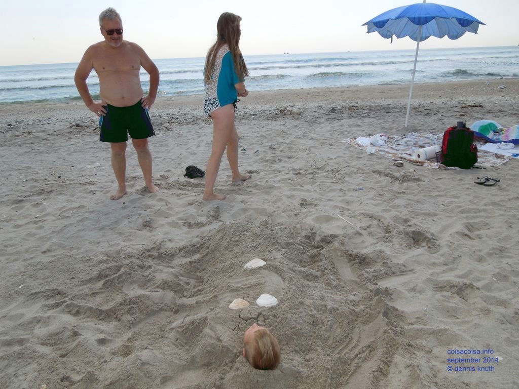Dennis amused with Jared in the sand