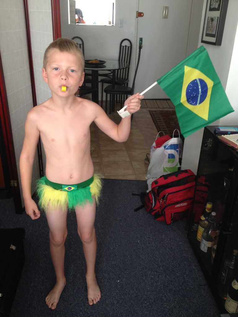 Jared in a hula skirt Brazilian flag