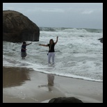 Sharon and Connor get caught by a surprise wave