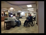 Emogene and family in a common area at Dove Healthcare