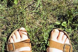 Man towes and feet on lawn